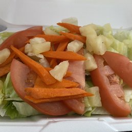 a salad in a styrofoam container a salad in a styrofoam container