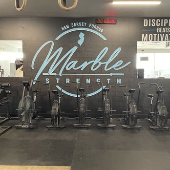Marble Strength  - Gym logo and assault bikes for working out - Gyms Near Me - Freehold, New Jersey