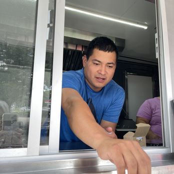 Wow Wow Tacos - One of the owners giving me their card - Tacos Near Me - Silver Spring, Maryland Wow Wow Tacos - One of the owners giving me their card - Tacos Near Me - Silver Spring, Maryland