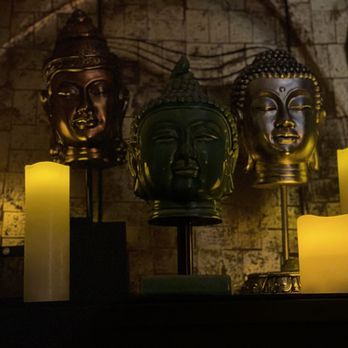 Massage by Antonio - Candles and Buddhist head sculptures to set the mood - Massage Therapy Near Me Massage by Antonio - Candles and Buddhist head sculptures to set the mood - Massage Therapy Near Me
