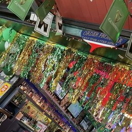 Festive, lots going on, variety of food and beverage, open air, game area, family friendly, TV for sports. Ready for St Patty's day.