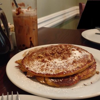 Eli's Table - Sweet potato pancakes (half portion) with jet fuel iced coffee. The full portion comprises four pancakes. - Southern Near Me - Charleston, South Carolina Eli's Table - Sweet potato pancakes (half portion) with jet fuel iced coffee. The full portion comprises four pancakes. - Southern Near Me - Charleston, South Carolina