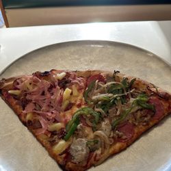 Brother's Pizza & Italian Restaurant - One slice of grilled green peppers and onion , pepperoni,and sausage. One slice pineapple, ham,and bacon!