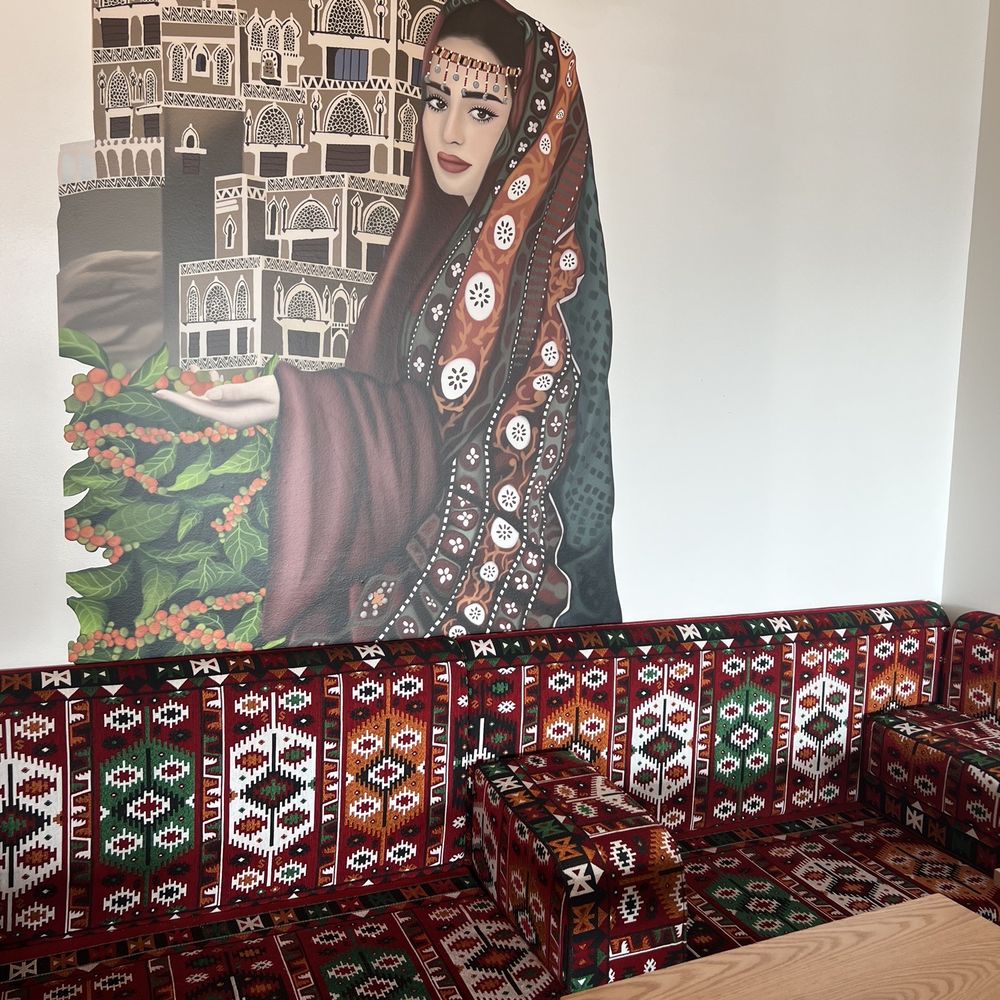 Qamaria Coffee - Even classier sitting area with a cool couch and quite the beautiful coffee companion. - Bakeries Near Me - Hilliard, Ohio Qamaria Coffee - Even classier sitting area with a cool couch and quite the beautiful coffee companion. - Bakeries Near Me - Hilliard, Ohio