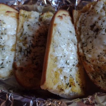 Jamestown Tavern - three slices of garlic bread on foil - Dive Bars Near Me - Lksid Marblhd, Ohio