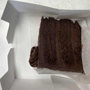 Jacqueline's Bakery & Café - A slice of chocolate cake - rich and delicious - Bakeries Near Me - Melbourne, Florida Jacqueline's Bakery & Café - A slice of chocolate cake - rich and delicious - Bakeries Near Me - Melbourne, Florida