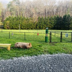 Highlands Riverbend RV Resort and Cabins - We love our furry campers . They can enjoy their very own bark park with a fire hydrant .