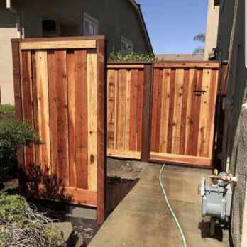 Modern View Landscape Logistics - Redwood Fencing for garbage bin enclosure with concrete pad. (Concrete not poured in picture yet) - Landscaping Near Me Modern View Landscape Logistics - Redwood Fencing for garbage bin enclosure with concrete pad. (Concrete not poured in picture yet) - Landscaping Near Me