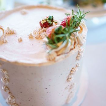 Lovejoy Bakery - a white cake with strawberries on top - Desserts Near Me Lovejoy Bakery - a white cake with strawberries on top - Desserts Near Me