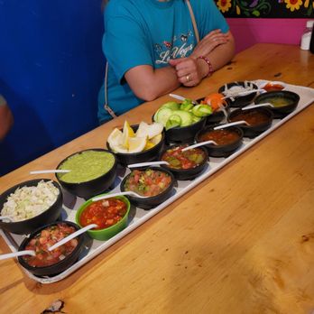 El Pirul - Check out this salsa and toppings platter. All the things you'll possibly need for your tacos! - Tacos Near Me - Mexicali, BCN El Pirul - Check out this salsa and toppings platter. All the things you'll possibly need for your tacos! - Tacos Near Me - Mexicali, BCN