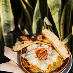 Gossip Grill - Ratatouille:
Eggplant, zucchini, tomato, squash, portobello mushroom roasted in a tomato sauce, topped with melted cheese, crostini