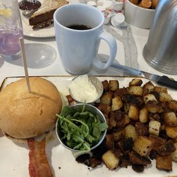 Bacon egg and cheese with well done potatoes. Bacon egg and cheese with well done potatoes.