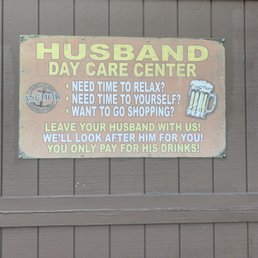 a sign for a husband's day care center a sign for a husband's day care center