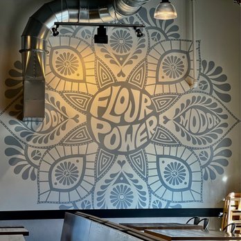 MOD Pizza - a mural of a floral design on the wall of a restaurant - Pizza Near Me - Boise, Idaho