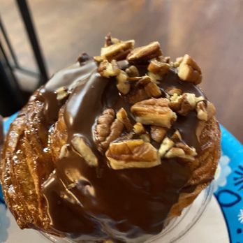 House of Coffi - a chocolate covered pastry on a plate - Coffee & Tea Near Me - Dover, Delaware House of Coffi - a chocolate covered pastry on a plate - Coffee & Tea Near Me - Dover, Delaware