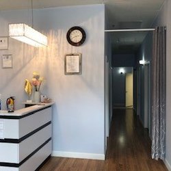 Springs Massage - Very nice open area with beautiful paintings on the walls. A modern and warm environment for professional massage therapy.
