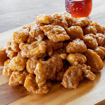 The Wing Experience - a pile of chicken nuggies on a cutting board - Chicken Wings Near Me - West Chester, Ohio The Wing Experience - a pile of chicken nuggies on a cutting board - Chicken Wings Near Me - West Chester, Ohio