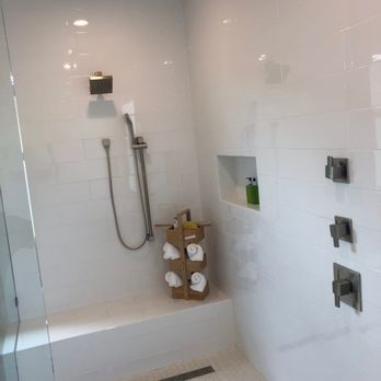 Floorco Design - a white tiled bathroom with a shower - Flooring Near Me - Corona, California