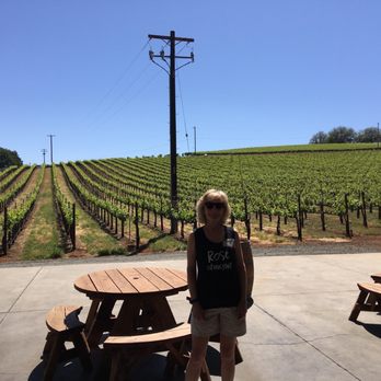 Gregory Graham Wines - Owner Marianne with Zin in the back ground. Best looking vines in the county - Wineries Near Me - Lower Lake, California Gregory Graham Wines - Owner Marianne with Zin in the back ground. Best looking vines in the county - Wineries Near Me - Lower Lake, California