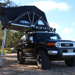 Our lifted FJ Cruiser with a rooftop tent.