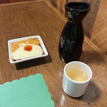 Sake Sushi - Close up - unmixed bomb sauce and Ginseng Sake - Sushi Bars Near Me - Royal Oak, Michigan