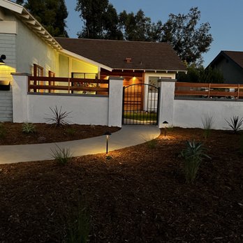 Rivetti Landscapes - a house with a fence and a gate - Landscape Architects or Designers Near Me Rivetti Landscapes - a house with a fence and a gate - Landscape Architects or Designers Near Me
