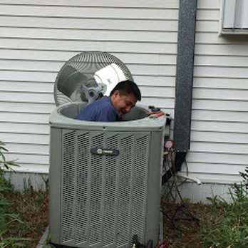 Jack Joyner Heating & Air Conditioning Company - Service Tech Xiong repairing a condensing unit - Heating & Air Conditioning/HVAC Near Me - Clearwater, Florida Jack Joyner Heating & Air Conditioning Company - Service Tech Xiong repairing a condensing unit - Heating & Air Conditioning/HVAC Near Me - Clearwater, Florida