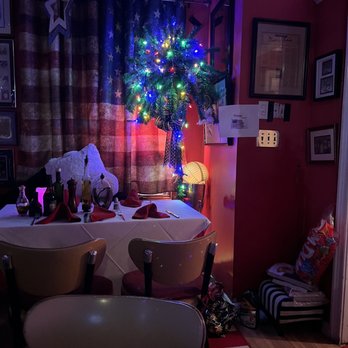 Angelina's - a christmas tree in the corner of a room - Italian Near Me - Bayonne, New Jersey