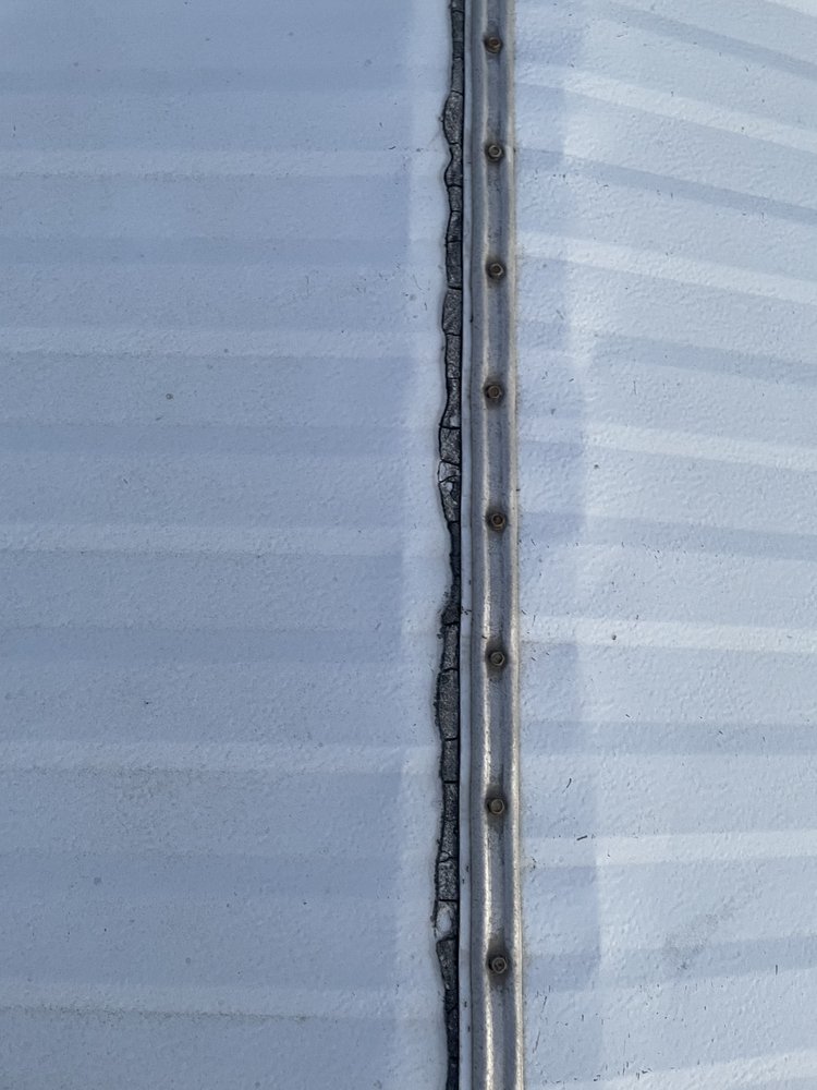 Slide of Andy The Roofer & Co