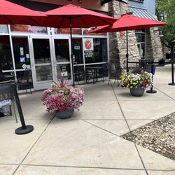 The Italian Twist - Here are the tables outside, shaded with beautiful potted flowers.