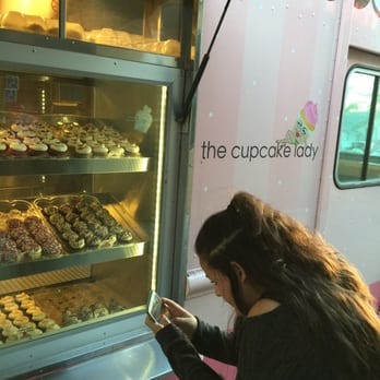 The Cupcake Lady - My kid taking a pic of the variety of cupcakes, so I took a pic of her - Food Trucks Near Me The Cupcake Lady - My kid taking a pic of the variety of cupcakes, so I took a pic of her - Food Trucks Near Me