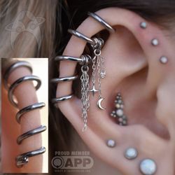 Aesthetic Ambition Piercing and Fine Jewelry - Custom spiral piece for a coinslot with charms attached
