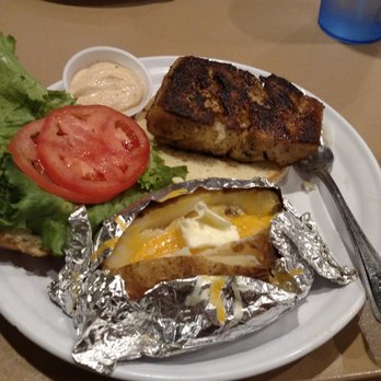 Iguanas - Blackened Mahi with baked potato. - Seafood Near Me - St. Simons, Georgia