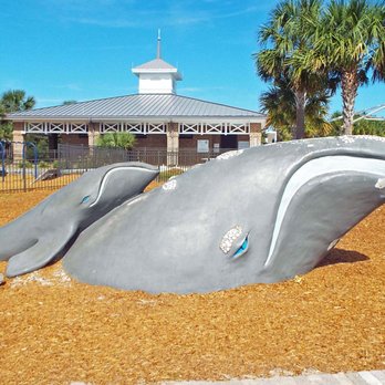 Neptune Park - Mama whale and her calf break the surface of their grassy ocean. - Parks Near Me - St. Simons Island, Georgia