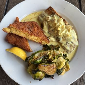 Inlet Prohibition Company - Mahi with Brussels sprouts and cheesy grit cakes. Chef's kiss! - Seafood Near Me - Murrells Inlet, South Carolina