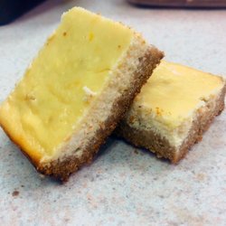 Eat Your Heart Out Edibles - Lightened up Greek Yogurt Lemon Bars will make your lips pucker, satisfy your sweet tooth, and keep your belt buckle in place!