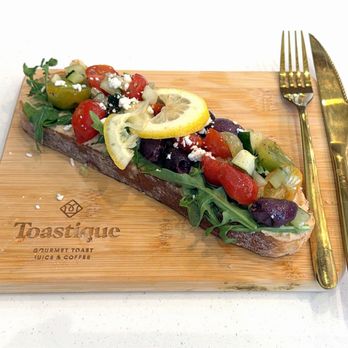 Toastique - Greek Toast (8.5" x 2.5") - Coffee & Tea Near Me - Overland Park, Kansas Toastique - Greek Toast (8.5" x 2.5") - Coffee & Tea Near Me - Overland Park, Kansas