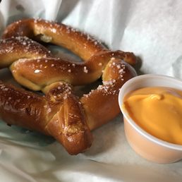 Pretzel with cheese sauce.