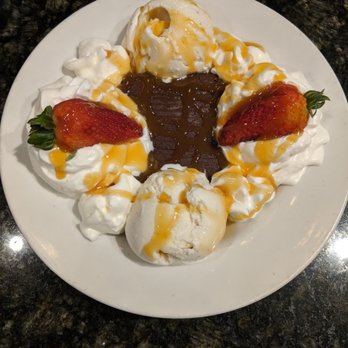 Mangieris - Brownie w/ vanilla bean ice cream, whip cream and strawberries. You can pick raspberry, caramel or chocolate sauce on top. Delish! - Pizza Near Me - Austin, Texas Mangieris - Brownie w/ vanilla bean ice cream, whip cream and strawberries. You can pick raspberry, caramel or chocolate sauce on top. Delish! - Pizza Near Me - Austin, Texas