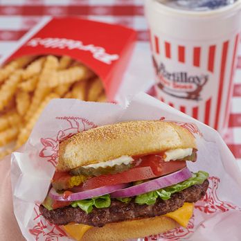 Portillo's Madison, Wisconsin - West Towne - a hand holding a sandwich - Hot Dogs Near Me - Madison, Wisconsin Portillo's Madison, Wisconsin - West Towne - a hand holding a sandwich - Hot Dogs Near Me - Madison, Wisconsin