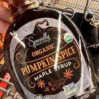 ALDI - a person holding a bottle of pumpkin spice syrup - Grocery Near Me - Huntsville, Alabama