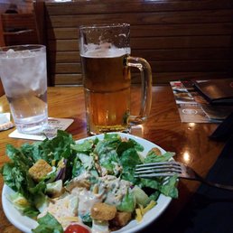 An ice cold Fosters, salad and an Outback burger after a long drive. An ice cold Fosters, salad and an Outback burger after a long drive.