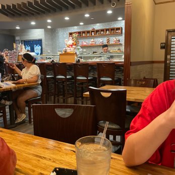 Ginger - a young boy sitting at a table with a glass of water in front of him - Japanese Near Me - Humble, Texas Ginger - a young boy sitting at a table with a glass of water in front of him - Japanese Near Me - Humble, Texas