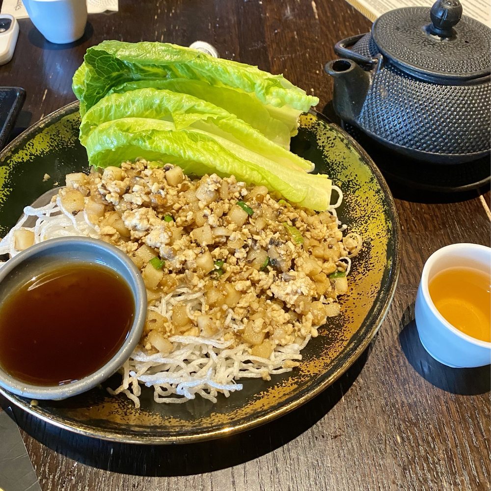 P.F. Chang's - GF Chang's Chicken Lettuce Wraps, Freshly Brewed Oolong Tea - Chinese Near Me - Austin, Texas P.F. Chang's - GF Chang's Chicken Lettuce Wraps, Freshly Brewed Oolong Tea - Chinese Near Me - Austin, Texas
