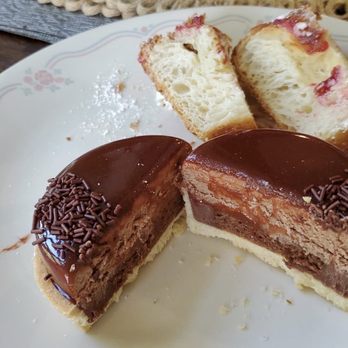 Petit Pierre Bakery - Section of chocolate tart and raspberry mascarpone cruffin - Bakeries Near Me - Seattle, Washington