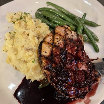 Uptown Grill - Pork Chop with a blackberry port reduction - Cocktail Bars Near Me - Olympia, Washington Uptown Grill - Pork Chop with a blackberry port reduction - Cocktail Bars Near Me - Olympia, Washington