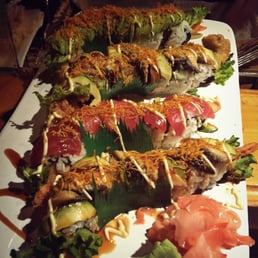 four fancy rolls, a mix shrimp, soft shell crab, topped with grilled eel, avocado and tuna. four fancy rolls, a mix shrimp, soft shell crab, topped with grilled eel, avocado and tuna.