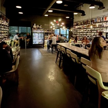 Graft Wine Shop - people sitting at the bar - Beer, Wine & Spirits Near Me - Charleston, South Carolina Graft Wine Shop - people sitting at the bar - Beer, Wine & Spirits Near Me - Charleston, South Carolina