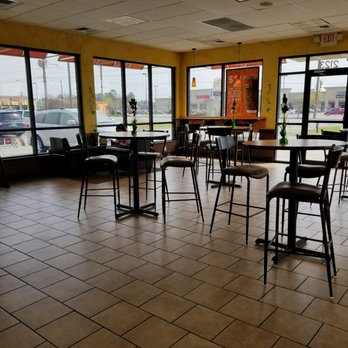 Dunkin' - empty tables and chairs in a restaurant - Donuts Near Me - Florence, South Carolina Dunkin' - empty tables and chairs in a restaurant - Donuts Near Me - Florence, South Carolina