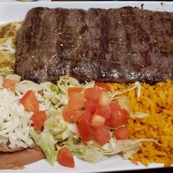 Burritos Mi Tierra - Tampiquena dinner ($22) is a grilled skirt steak with enchilada, rice, beans, lettuce and tomato